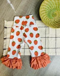 Super cute Strawberry pants, double ruffles of the softest knit fabric.  Perfect for strawberry season, birthday parties or just to wear any day and look adorable! Strawberry Pants, Strawberry Season, Cute Strawberry, Strawberry Fields, Flare Pants, Soft Knits, Knit Fabric, Ruffles, Knitted Fabric