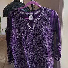 Cotton Purple With White Embroidery. Purchased At Tge Srf Gift Shop In Encinitas. Never Worn W Tags Embroidered Bohemian Purple Kurta, Bohemian Embroidered Purple Kurta, Purple Embroidered Long Sleeve Kurta, Bohemian Purple Embroidered Kurta, Long Sleeve Cotton Tunic With Intricate Embroidery, Cotton Long Sleeve Tunic With Intricate Embroidery, Cotton Tunic With Intricate Embroidery And Long Sleeves, Cotton Tunic With Embroidered Neckline And Long Sleeves, Bohemian Long Sleeve Kurta With Embroidered Hem