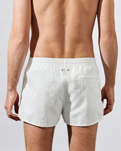 Our Swim Shorts in nylon poplin are designed with a regular fit, short leg and mesh lining for comfort and support. Made of recycled polyamide in a soft mid-weight with a slightly brushed finish.    Regular fit, short leg  Inside leg length size M 6.5 cm/2.6"  Fits true to size   Mesh lining for comfort and support   Elastic waistband with drawstring   Side seam pockets and back zip pocket for secure credit card storage   CDLP branded metal eyelets     Quick-drying   No-tag construction   Style Nylon Bottoms With Built-in Shorts For Beach Season, White Swim Trunks For Beachwear, White Swim Trunks For Outdoor Beachwear, White Beachwear Swim Trunks For Outdoor, White Shorts For Beach Season Outdoor Activities, White Beach Season Shorts For Outdoor, White Shorts For Outdoor Beach Season, White Summer Shorts For Outdoor, White Summer Bottoms For Outdoor