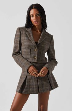 A cropped silhouette adds an on-trend touch to our Siarah Jacket—timelessly tailored and finished with front patch pockets and bold buttons. Pairs perfectly with our matching mini skirt, or wear it with jeans and a T-shirt for a laid-back weekend look. Chic Button-up Tweed Jacket With Pockets, Tailored Trendy Cropped Jacket For Work, Trendy Tailored Cropped Jacket For Work, Button-up Cropped Jacket With Patch Pockets For Work, Workwear Cropped Button-up Jacket With Patch Pockets, Chic Cropped Blazer With Pockets, Cropped Winter Blazer With Pockets, Fall Cropped Jacket With Patch Pockets For Work, Fitted Cropped Jacket With Patch Pockets For Fall