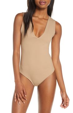 Wide straps frame this sleek and shapely bodysuit designed with a perfectly dipped neckline. V-neck Sleeveless Partially lined 88% nylon, 12% spandex Hand wash, line dry Made in the USA or imported Lingerie