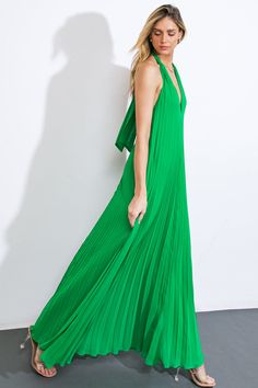 A solid woven maxi dress featuring V halter neckline, fully pleated, bare back with back neck tie Self: 100% Polyester Lining: 100% Polyester Dressy Shirts, Flying Tomato, Skirt Jumpsuit, Pleated Maxi Dress, Pleated Maxi, Halter Neckline, Event Dresses, Sweatshirt Dress, Baby Month By Month