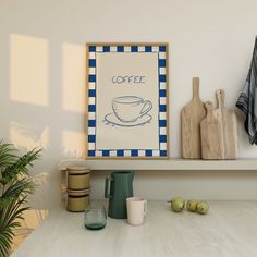 there is a coffee sign on the shelf next to some cups and cutting utensils