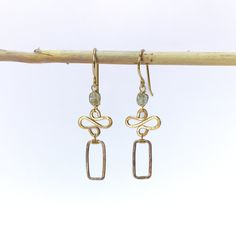 These delicate earrings feature a harmonious blend of elements that exude tranquility and grace. Intricately wire-wrapped moss aqua gemstones are complemented by 14k gold filled swirls and oxidized sterling silver rectangles. Designed to be the perfect accessory for both causal and formal occasions, these earrings offer a subtle and elegant statement. The moss aqua gemstone adds a soothing touch, while the gold filled swirl and silver rectangle provide a captivating contrast.Their lightweight de Hand Forged Rectangular Gold Jewelry, Aqua Gemstone, Moss Aquamarine, Jewelry Repair, Delicate Earrings, Oxidized Sterling Silver, Semi Precious Gemstones, Wire Wrapped, Wire Wrapping