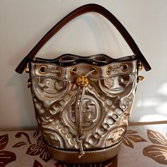 This Beauty Is Brand New And Hasn’t Been Used- Just Made An Impulsive Purchase And I’m Not A Huge Crossbody/Bucket Bag Person! Tags Were Removed But I Still Have Them As You’ll See In One Of The Attached Images. Dust Bag Included! Luxury Tan Pouch Shoulder Bag, Designer Gold Bucket Bag For Everyday Use, Luxury Gold Rectangular Bucket Bag, Luxury Gold Bucket Bag With Detachable Strap, Designer Gold Bucket Bag With Detachable Handle, Luxury Silver Leather Bucket Bag, Designer Gold Rectangular Bucket Bag, Designer Gold Bucket Bag For Travel, Designer Gold Bucket Shoulder Bag