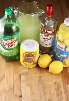 the ingredients to make lemonade sit on a wooden table