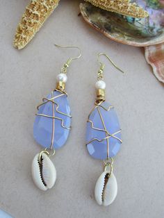 Aqua Chalcedony and freshwater pearl earrings with cowrie shells. Blue Mother Of Pearl Jewelry For Beach, Ocean-inspired Blue Shell Jewelry, Blue Shell-shaped Handmade Jewelry, Handmade Blue Shell Jewelry, Handmade Cowrie Shell Earrings As Gift, Handmade Cowrie Shell Earrings For Gift, Blue Shell-shaped Jewelry For Vacation, Blue Bohemian Shell Jewelry, Summer Blue Shell Jewelry