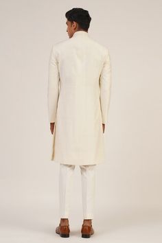 Ivory full sleeve sherwani with round high neckline. - Aza Fashions Ceremonial Off White Long Sleeve Kurta, Classic Cream Kurta For Festive Occasions, Classic Cream Bandhgala For Festive Occasions, Classic Cream Sherwani For Festive Occasions, Festive Classic Cream Kurta, Off White Straight Kurta For Formal Occasions, Fitted Cream Churidar For Formal Occasions, Classic Sherwani With Naqshi For Wedding, Classic Fitted Sherwani With Naqshi Detailing