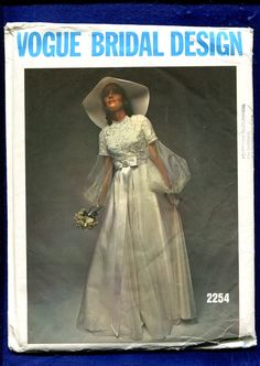 the front cover of a magazine with a woman in a white dress and large hat