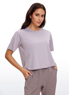 Smooth and stretchy fabric provides cotton-like breathability and softness, keeping you cool all day long. Basic cropped shirt with a loose fit and high crewneck for moving freely. Suitable for low-impact workouts, such as yoga, pilates, lounging, etc. Feature & Fitting: 
 Design for yoga 
 Waist length, relaxed fit 
 Cropped and round neck design 
 Fabric: 
 Smooth, Skin-friendly 
 Breathable, Lightweight 
 Quick dry, Moisture wicking 
 Anti-pilling and Durable 
 70%Cotton, 30%Polyester 
 S Lightweight Shorts, Waist Length, Low Impact Workout, Crop Shirt, Moisture Wicking, Neck Designs, Pilates, Round Neck, Fabric Design