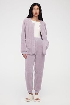 Relaxed, cozy comfort for the cooler months — this Sherpa Fleece Pajama Set is the perfect choice for staying warm as you curl up with your favorite book or take a weekend stroll around the neighborhood. Details Materials & Care Shipping & Returns • Set includes pajama top and pants — a plush set for staying warm in cool weather.• Button-up top features pockets for accessories. Pants feature an elastic waistband and cuffed legs. Size M top is 26.8" and bottom is 39.5" in length.• Tailored in dou Sherpa Pajamas, Pajamas Women Winter, Pajama Set Winter, Winter Pajama, Winter Pajamas Women, People Reference, Pajama Fashion, Women Sleepwear, Cozy Pajamas