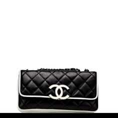 Chanel Black and White Medium Cruise Flap Stunning and rare small Chanel black and white lambskin quilted Cruise flap. As seen on Penelope Cruz in the larger version of this same exact bag. This unique bag has a large CC white hardware closure. Silver hardware, classic lambskin interwoven chain, grey satin interior lining, and an interior zippered pocket. 5.5" height x 10.5" width x 2" depth Single strap 18" doubled 9.5" Year 2008 {Vintage 13 Years} Condition: Very Good Made in Italy Chanel Bag Black And White, White Chanel Bag, Designer Purses And Handbags, Chanel Black And White, White Hardware, Luxury Bags Collection, Chanel Box, White Handbag, Penelope Cruz