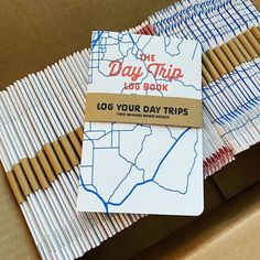 the day trip log your day trips are on top of cardboard boxes with pencils