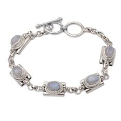 Elegant links are crafted of sterling silver circling the wrist in this bracelet from Bali. Buana designs the bracelet adding a natural rainbow moonstone to each link for an accessory that brings a misty charm to the wearer. Silver Bohemian Moonstone Bracelets, Bohemian Silver Moonstone Bracelets, Spiritual Sterling Silver Moonstone Bracelet, Heart Dangle Earrings, Moonstone Bracelet, Natural Rainbow, Silver Cuff Bracelet, Jewelry Packaging, Silver Cuff