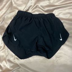 Black Nike Shorts Never Worn! Size Medium Black Bottoms For Summer Workout, Black Stretch Nike Bottoms, Nike Black Stretch Bottoms, Nike Black Athletic Shorts With Elastic Waistband, Nike Black Bottoms With Built-in Shorts, Nike Black Athletic Shorts With Built-in Shorts, Nike Black Athletic Shorts For Workout, Nike Black Workout Shorts, Nike Black Gym Shorts