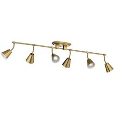 four light brass track lighting fixture with three bulbs on each end and one bulb down