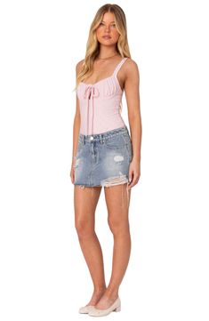 An on-trend low-rise cut defines this nonstretch-denim skirt featuring allover distressing for a chic lived-in look. Zip fly with button closure Five-pocket style 100% cotton Machine wash, dry flat Imported Fitted Mini Length Jean Shorts With Frayed Hem, Fitted Denim Skirt With Frayed Hem For Summer, Fitted Mini Skirt With Frayed Hem For Summer, Trendy Ripped Mini Denim Skirt, Ripped High Rise Denim Skirt For Summer, High Rise Ripped Denim Skirt For Summer, Chic Fitted Jean Shorts With Frayed Hem, Ripped Mini Skirt For Summer, Summer Mid-rise Distressed Denim Skirt