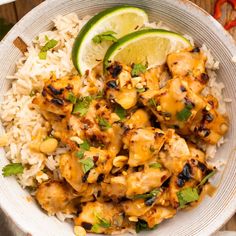 a white bowl filled with chicken and rice