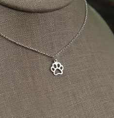 a necklace with a paw print on it