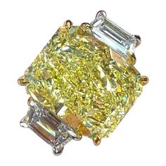 This fancy yellow radiant cut diamond is offered by Antinori di Sanpietro ROMA. This 4ct fancy light yellow radiant diamond is custom set in a handcrafted Antinori di Sanpietro ROMA platinum and 18 karat yellow gold. 3 stone ring consisting of 1 radiant cut fancy yellow diamond weighing 4.02 carats with VVS2 clarity accompanied by GIA report, accented by 2 side diamonds with a total weight of approximately 1 carat, and a respective color and clarity of E-F VS1-VS2 quality. Light Yellow Diamond Ring, Light Yellow Diamond, Yellow Diamond Earring, Yellow Diamond Ring, Fancy Light, Yellow Diamond Rings, Fancy Lights, Fancy Yellow Diamond, Yellow Jewelry