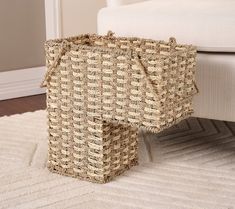 a basket sitting on top of a white rug