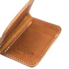 Made in Laurel, MS Made from American cowhide Four card slots Cash/receipt slot on either side 4.75" x 7" when open Rectangular Wallets With Leather Lining For Everyday Carry, Classic Bifold Card Holder With Slots, Classic Bifold Card Holder With Card Slots, Brown Wallets With Interior Card Slots For Everyday, Bifold Card Holder With Pen Slots For Everyday Use, Brown Wallet With Interior Card Slots For Everyday, Classic Bifold Wallet With Leather Patch, Classic Wallets With Pen Slots, Classic Everyday Wallets With Pen Slots