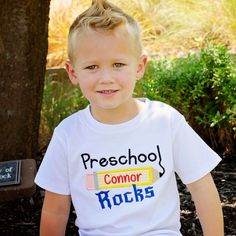 It's back to school time! Help your little one stroll into school with our Preschool Rocks Design Tee. Order options: Personalize with first name Select thread color for name Styles Girls short sleeve puff Girls short sleeve puff with ruffle bottom Unisex short sleeve Unisex raglan sleeve Girls puff tee sizes 12mo, 18mo, 2T, 3T, 4T, 5T, 6, 8, 10 Unisex tee sizes 12mo, 18mo, 2T, 3T, 4T, 5T, 6, 8 Raglan tee sizes 12mo, 18mo, 2T, 3T, 4T, 5T, 6, 8, 10 Preppy Short Sleeve School T-shirt, Preppy Short Sleeve T-shirt For School, School Spirit Short Sleeve T-shirt, Preppy Letter Print School Top, Short Sleeve T-shirt For School Spirit, Cute Short Sleeve T-shirt For Students, Cute Short Sleeve T-shirt For School, Name Print T-shirt For Daycare With School Spirit, School Spirit Short Sleeve Tops