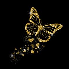 a gold butterfly flying through the air with sparkles on it's wings and tail