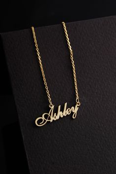 "Personalized name necklace, dainty necklace, custom Ashley name necklace, anniversary gift for wife, gift for fiancé, 14K solid gold jewelry; You have landed at the perfect place to find the ideal gift for your loved ones. If you want to make their special day remarkable, or you just want to make them feel special, a necklace is definitely the best gift you can ever find! Explore the numerous options that my store offers to choose the perfect necklace. Among many necklaces you will find celestial jewelry as well as personalized gifts, all SOLID GOLD material, as well as diamond! ► DETAILS: Necklaces in 14k, 18K yellow, white, and rose gold.  You can find customized name necklaces where you can place any name and symbol you like. We use unique materials and handcraft each piece of jewelry. Elegant Custom Name Jewelry For Anniversary Gift, Elegant Name Necklaces For Anniversary Gift, Elegant Custom Name Necklace For Anniversary, Gold Pendant Name Necklace For Anniversary, Silver Gold Plated Name Necklace For Anniversary, Classic Pendant Name Necklace For Anniversary, Elegant Engraved Name Necklace For Anniversary Gift, Elegant Hallmarked Name Necklace For Personalized Gift, Personalized Hallmarked Nameplate Necklace