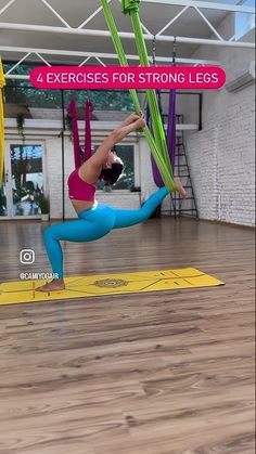 a woman doing aerial yoga exercises on a mat with the words 4 exercises for strong legs