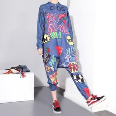 Graffiti Denim Harem Jumpsuit – whimsyandever Casual Multicolor Overalls For Spring, Casual Graphic Print Jumpsuits And Rompers For Summer, Casual Summer Jumpsuits And Rompers With Graphic Print, Casual Multicolor Jumpsuits And Rompers For Fall, Casual Blue Stretch Overalls, Printed Blue Cotton Jumpsuit And Romper, Blue Printed Cotton Jumpsuits And Rompers, Fitted Denim Jumpsuit For Spring Streetwear, Casual Multicolor Overall Jumpsuits And Rompers