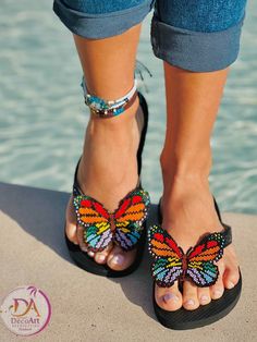 Beautiful Havaianas flip flops embroidered with multicolored beaded butterflies, handmade. Use them for your vacations to the beach or simply for any occasion.  dare to shine. Beautiful flip flops for women, which has a multicolored beaded butterfly decoration.  Handmade with love by Colombian artisans, which makes it a unique and exclusive sandals of excellent quality.  add it to your cart and wear some original and beautiful flip flops, as well as supporting our Colombian Artisans. Now availab Flip Flops Havaianas, Beaded Butterflies, Butterfly Decoration, Flip Flops For Women, Beaded Butterfly, Fall Getaways, Havaianas Flip Flops, Beaded Sandals, Support Local