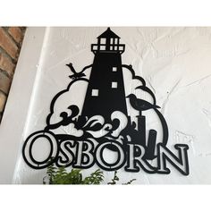 a black and white sign that says osbornn on the side of a building