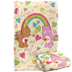 a teddy bear blanket and pillow set on a white background with hearts, rainbows and bears