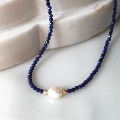 Natural Lapis Necklace for Women, Birthday Gifts for HerStunning and chic this beaded lapis lazuli necklace is the perfect everyday necklace or gift. Lapis is know as the friendship stone!•Gorgeous, genuine and natural 3mm lapis lazuli beaded by hand with freshwater pearl•Adorned with 14kt gold filled accents Water friendly Adjustable Single Strand Lapis Lazuli Necklace, Lapis Lazuli Beaded Necklaces For Gift, Single Strand Lapis Lazuli Beaded Necklace As Gift, Diy Pearl Necklace, Women Birthday Gifts, Beaded Necklace Patterns, Lapis Necklace, Pearls Diy, Lapis Lazuli Necklace