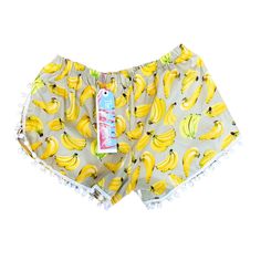 "How FABULOUS is this Print? These shorts are made from a Mid weight 100% Cotton fabric - Printed with this fab, vivid Banana design.  Finished off with a cute pom pom trim and an elasticated waistband.  Perfect for making a statement this season! DETAILS: Banana print Casual fit Elasticated waistband Pom Pom trim White topstitch  FABRIC:  100% Cotton STYLE:  Cut in a casual fit with an elasticated waistband and wide fit leg.   READY TO BUY: 8 - 10 - Pom Poms 6-8cm Waistband: 66 - 88cm 8-10cm Wa Banana Design, Pom Pom Shorts, Cute Pjs, Banana Print, Pom Pom Trim, Casual Fit, Casual Fits, Pom Poms, Cotton Style