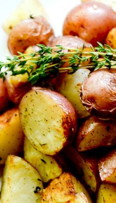 potatoes with herbs and seasoning on a white plate