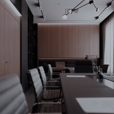 an empty conference room with black chairs and wooden paneling on the walls, along with bookshelves