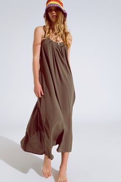 Elevate your summer wardrobe with this effortlessly chic khaki maxi dress. Crafted from 100% viscose, it offers a flowy fit and lightweight comfort, perfect for warm weather. The dress features delicate spaghetti straps adorned with intricate beaded details, adding a touch of elegance to the ensemble. With its round neckline and relaxed silhouette, this versatile dress can be worn as a stylish cover-up or as a standalone piece for any occasion.   Material: 100% Viscose  Model is wearing size S.  Model is: 29-25-35 Height: 5'11''.  The S-M sizing corresponds to US sizes of 4 and 6 respectively.  Relaxed Fit.  Length: Standard.  Maxi length  Sleeveless style  Relaxed fit  Comfy  Criss-cross design at back  Lightweight woven fabric Dress Sleeves, Skirt Jumpsuit, Versatile Dress, Khaki Dress, Cross Design, Knitwear Tops, Versatile Dresses, Romper Pants, Sweatshirt Dress