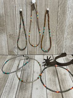 Made from sea beads **brown/turquoise - 17 inches **grey/red/orange - 17 inches **tan serape - 17 inches **earthtone - 16 inches **silver/brown/turquoise - 17 inches **pear/turquoise/rust - 16 inches Southwestern Style Large Beads For Beach, Southwestern Style Large Beads, Southwestern Style Large Beach Beads, Adjustable Brown Heishi Beads Necklace, Brown Beaded Bracelet For Summer, Adjustable Beaded Brown Choker, Adjustable Brown Beaded Choker, Summer Brown Beaded Bracelets, Brown Beaded Necklaces For Beach