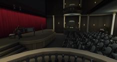 an empty auditorium filled with chairs and a piano