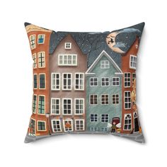 a pillow with an image of houses on it