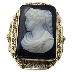 Vintage 14 Karat Yellow Gold Black Onyx Cameo Ring Size 4.75- This elegant black onyx cameo ring features a lovely lady in profile set in beautifully detailed 14K yellow gold. Width: 21 mm. Shank: 1 mm. Ring Size: 4.75 Weight: 2.7 dwt. / 4.3 gr. Tested for 14K gold. Very good condition, professionally polished. Will come packaged in a gift box or pouch (when possible) and will be shipped U.S. Priority Mail Insured. DV082222/17KCS Vintage Onyx Ring 1stdibs, Profile Set, Black Cameo, Cameo Ring, Black Onyx, Gold Black, Priority Mail, Fashion Rings, Onyx