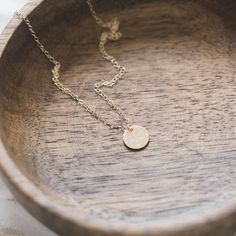 This 14k gold filled disc necklace has a beautiful hammered and polished finish. A lovely minimal piece which is perfect for layering with other necklaces as well as wearing on its own. 14k gold filled chain and spring clasp 14k gold filled hammered and polished disc - 9mm diameter Beautifully packaged in a gift box ready for gift giving Chain length available in 16/18/20 inches, perfect for layering.  Please message me for custom length. Additional discs can be added at a cost of £3.00 per disc Minimalist Hammered 14k Gold Filled Necklaces, Dainty Hammered 14k Gold Necklace, Simple Jewelry With Delicate Chain And Round Disc, Minimalist 14k Gold Filled Round Disc Necklaces, Simple Hammered Rose Gold Jewelry, Dainty Hammered Coin Necklace As Gift, Hammered Round Disc Minimalist Necklace, Simple Gold Round Disc Necklaces, Simple Gold Round Disc Necklace