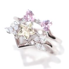 This magical girl ring set is sterling silver.925 plated in rhodium with pastel cubic zirconia stones. The accent band features pink heart shaped stones in the shape of a bow. The. Prom Jewelry Earrings, Silver Prom Jewelry, Ethereal Jewelry, Unique Wedding Jewelry, Flower Wedding Ring, Moon And Star Ring, Yellow Star, Silver Jewelry Earrings, Simple Engagement Rings