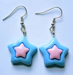 Pastel colours pink and blue star earrings. See video clip and photos close-up for detail. Very light weight to wear. Silver plated fishhooks, see photos close-up for detail. Handmade Pink Star-shaped Jewelry, Cute Dangle Earrings With Star Charm, Cute Star Charm Dangle Earrings, Pink Star Charm Dangle Earrings, Pink Dangle Earrings With Star Charm, Cute Pink Jewelry With Star Charm, Blue Star Charm Dangle Earrings, Blue Dangle Earrings With Star Charm, Multicolor Star Earrings