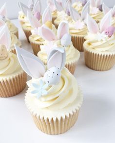 cupcakes decorated with white frosting and bunny ears