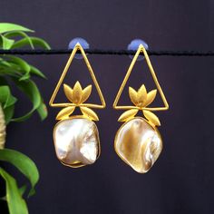 Fancy Party Wear Earrings. Made From Fine Quality Brass With Gold Platting. Perfect gift for any occasion for yourself and your dear ones. These Earrings can be worn with all kind of Outfits. It is advisable to store jewellery in a zip lock pouch (air tight pouch), keep away from water perfume and other chemicals and clean it with dry and soft cloth. Handmade Pearl Drop Earrings For Party, Handmade Gold Pearl Earrings For Party, Handmade Gold Pearl Earrings For Wedding, Handmade Pear-shaped Pearl Earrings For Wedding, Handmade Pear-shaped Wedding Earrings, Water Perfume, Earrings Indian, Fancy Earrings, Bollywood Jewelry