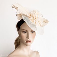 Elegant Ivory  Kentucky derby hat for woman.This cream  fascinate hat is embellished with a big bow.It is a perfect hat for weddings, Royal Ascot horse races, cocktails, derby...It is mounted on a headband.If you want, you can choose the side of the head were you like to wear the fascinator, just convo me.Any color of the fascinator can be changed to order. **  PROCESSING TIME: 5 -7 business days.**  DELIVERY TIME (DHL Express): 2-4 business days to EEUU, 1-2 to Europe and 3-5 to Australia.Follo Formal Cream Headpiece With Short Brim, Evening Mini Hat In Cream With Short Brim, Cream Evening Mini Hat With Short Brim, Cream Fitted Fascinator With Pinched Crown, Beige Evening Fascinator Hat, Elegant Cream Hat Headpiece, Elegant Cream Headpiece With Pinched Crown, Beige Short Brim Headpiece For Evening, Chic Cream Adjustable Headpiece