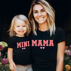 "Mama and Mini Shirt, Mom and Daughter, Mom and Me Shirt, Gift for Mom, Mothers Day Shirt, Family Matching Shirt, Mothers Day Gift, Mama Gift Hi!  Welcome. It's great to see you here! ☺️ Our shirts are clean, high quality and soft. It is prepared quickly by our boutique.  Ironing and shipped.  Enjoy your shopping! It is a pleasure for us to help you with your questions and you can reach us at any time. Please, don't forget to check our size cards. HOW TO ORDER SHIRT 👕 Please, choose your favori Cute Family Shirt With Letter Print, Cute Slogan Tops For Mother's Day, Black Family Matching Shirt For Mother's Day, Cute Mother's Day Slogan Tops, Short Sleeve Slogan Shirt For Mother's Day, Cute Tops With Funny Text For Family Events, Cute Black T-shirt For Mother's Day, Cute Tops With Funny Text For Family, Mother's Day Short Sleeve Slogan Shirt